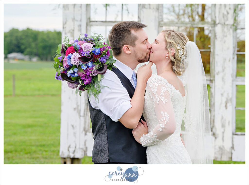 Bride and groom kissing after their wedding ceremony at Nickajack Farms in Ohio