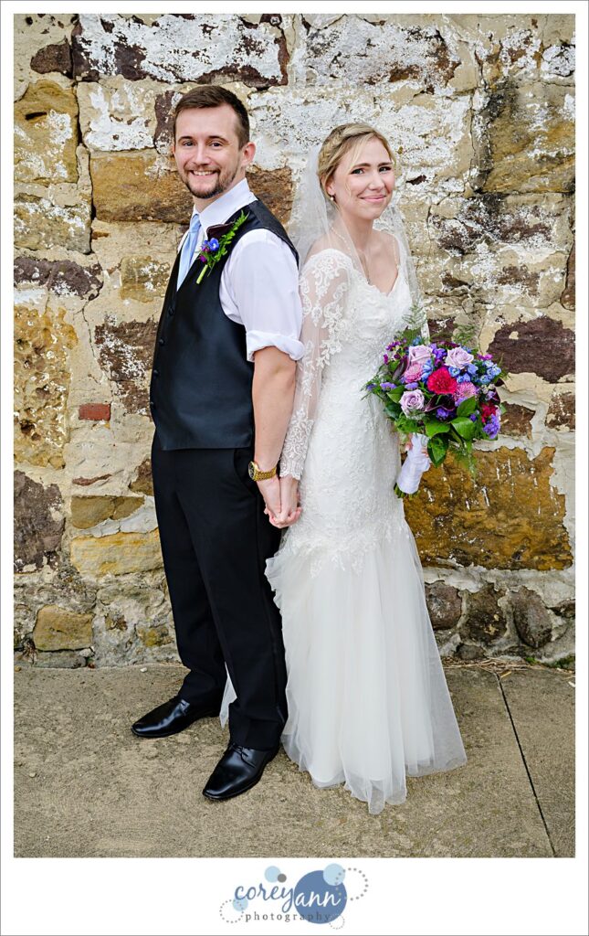 Bride and groom with backs together at Nickajack Farms after their wedding