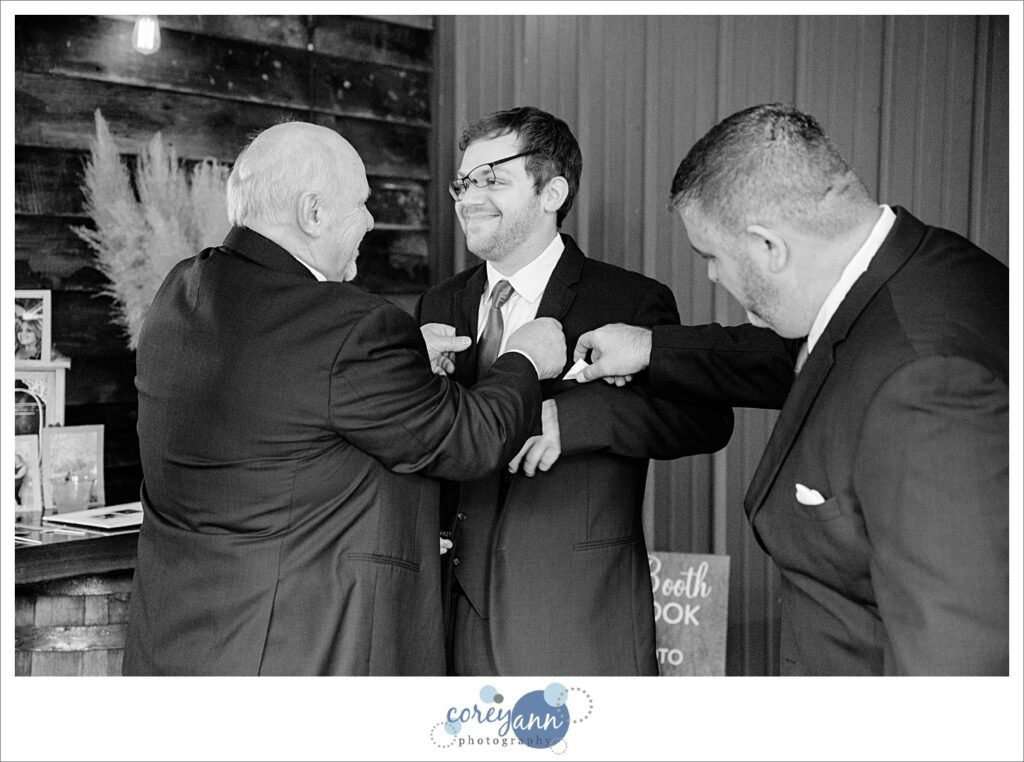 Men getting ready for wedding at Barn on Enchanted Acres in Dennison Ohio
