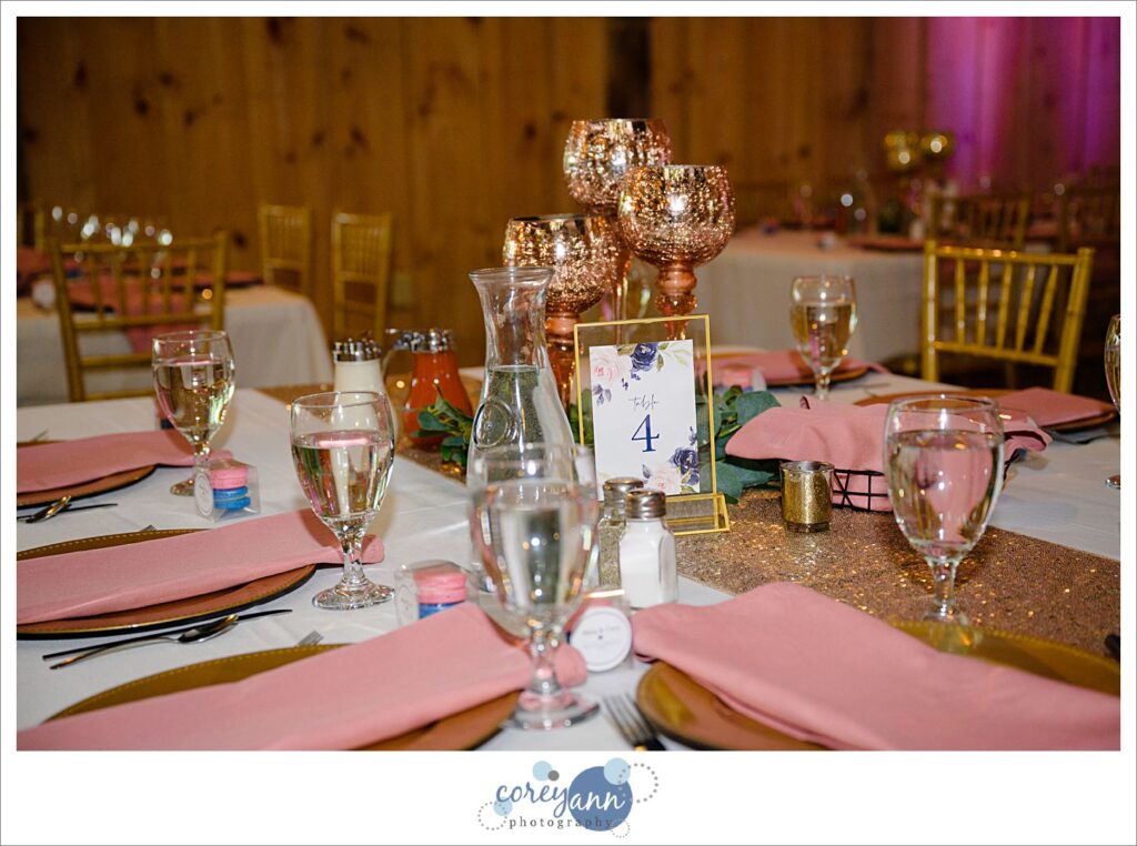 Pink and floral wedding reception decor at The Barn on Enchanted Acres