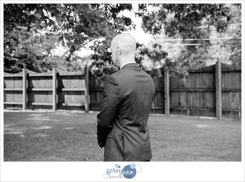first look between bride and groom in the outdoor wedding ceremony space at Whitehall Columbia in Ohio