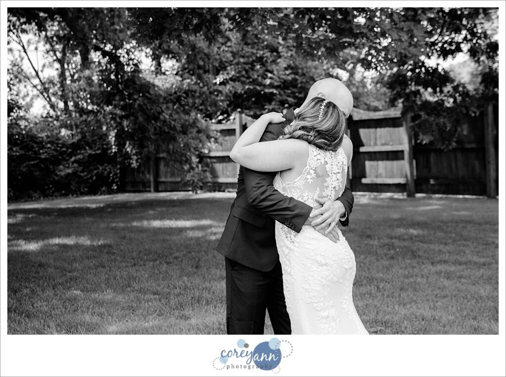 first look between bride and groom in the outdoor wedding ceremony space at Whitehall Columbia in Ohio