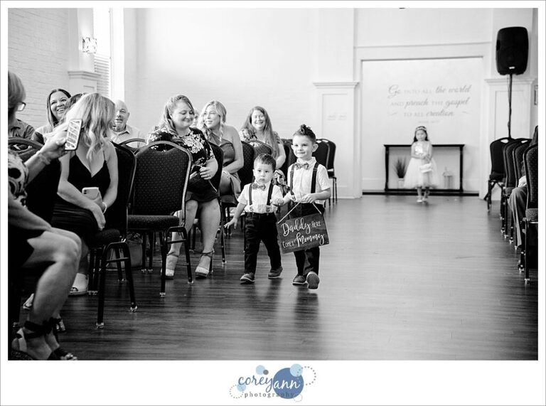 Two ringbearers with a sign for their daddy before their Mom walks down the aisle before their wedding at Whitehall Columbia