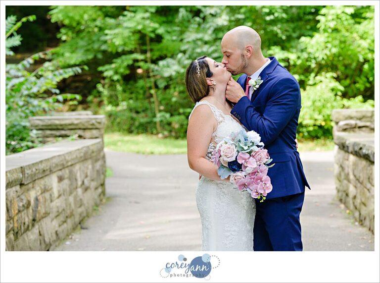 Wedding photos David Fortier River Park in Olmsted Falls in August with bride and groom who is wearing a blue suit