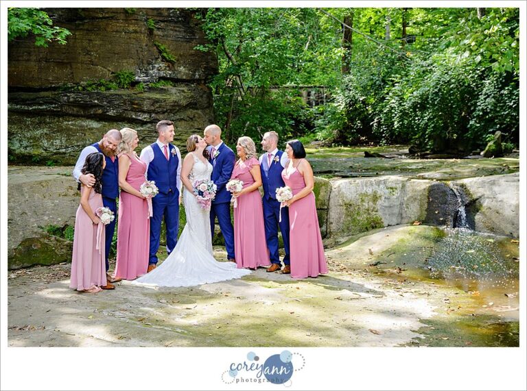 Pink and blue bridal party posing for a portrait after a wedding in Olmsted Falls Ohio