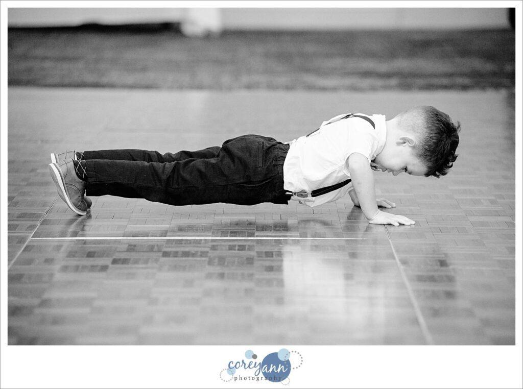 Ring Bearer entering wedding reception at Holiday Inn in Independence Ohio