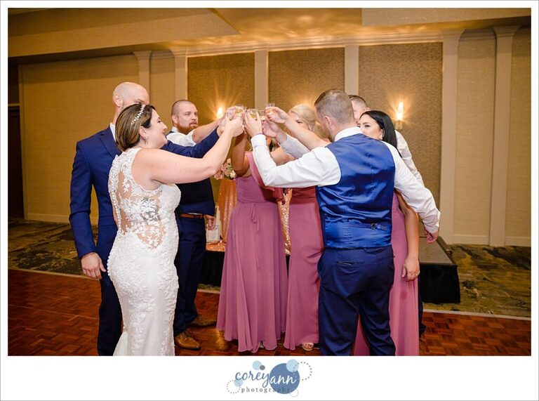 Bridal Party doing shots after entering wedding reception at Holiday Inn in Independence Ohio