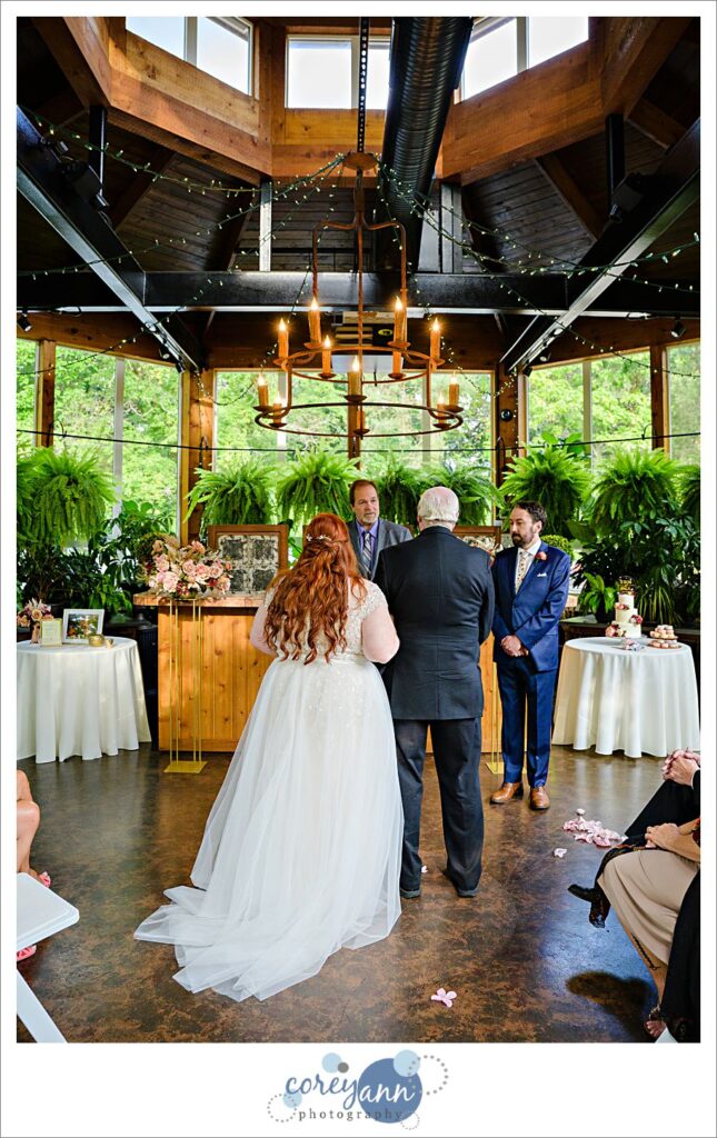 Intimate wedding ceremony at conservatory at Gervasi Vineyard in Canton Ohio