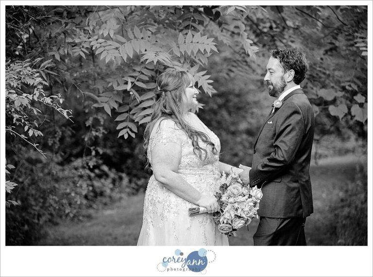 Black and white portrait of a bride and groom looking at each other after their wedding at Gervasi Vineyard