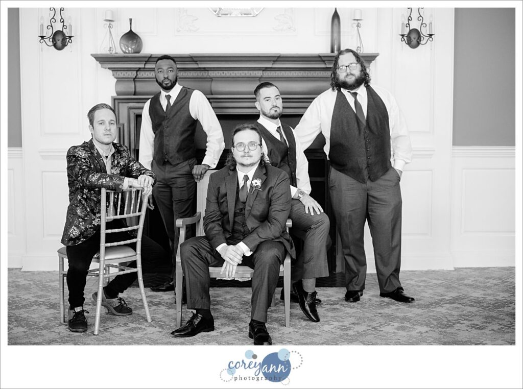 Groom and groomsman casually pose for a portrait at Manakiki Golf Course in Ohio