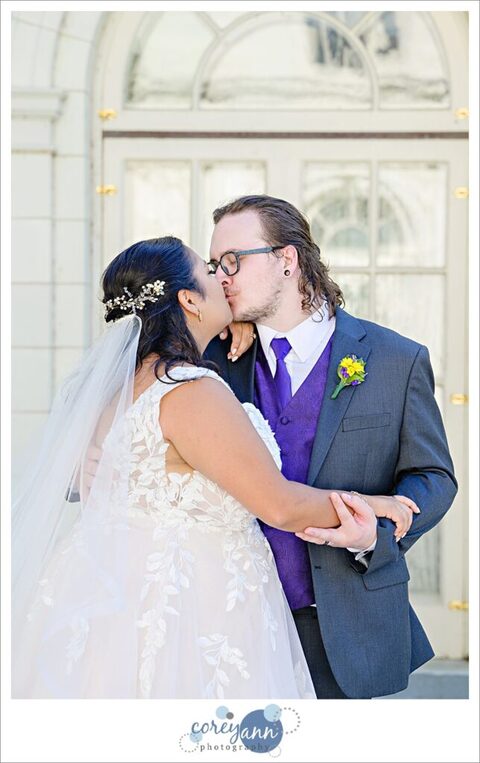 Bride and Groom kissing in front of Coulby Mansion for a wedding photo
