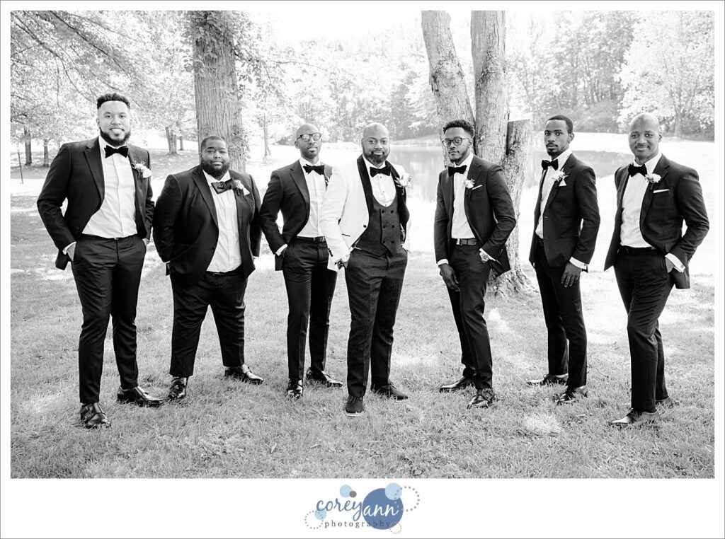 Groom and groomsman posing before wedding ceremony at Sun Valley in Ohio