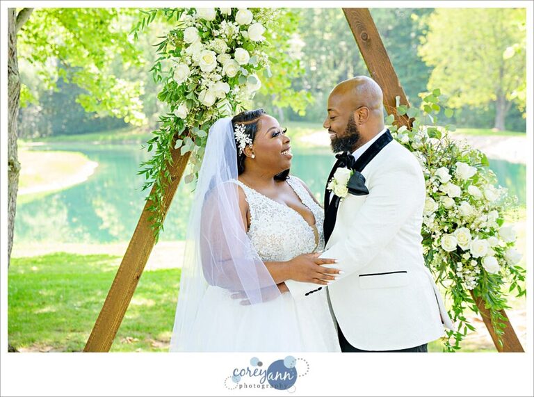 Bride and groom posing at Sun Valley Ohio before their wedding in August