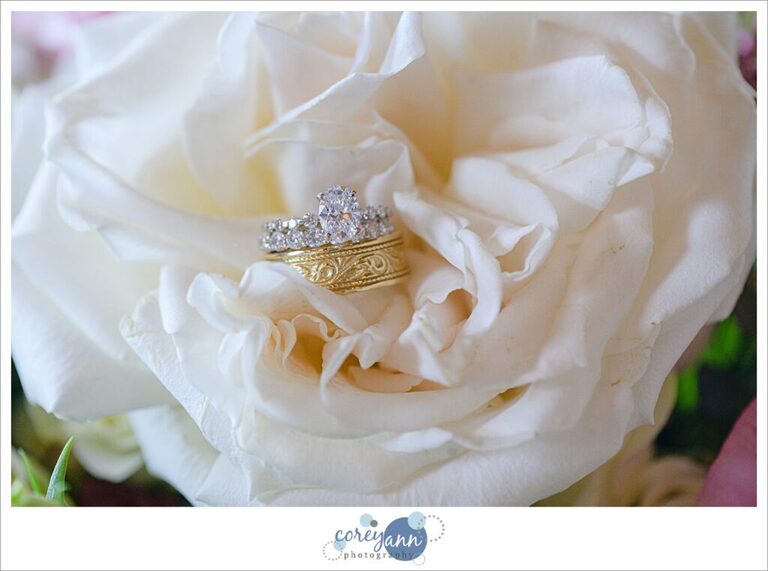 Oval diamond engagement ring and wedding bands in a rose