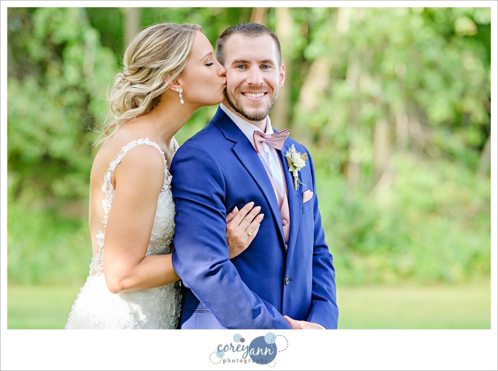 bride and groom posing after their wedding ceremony at Tudor House on Portage Lakes in Akron Ohio