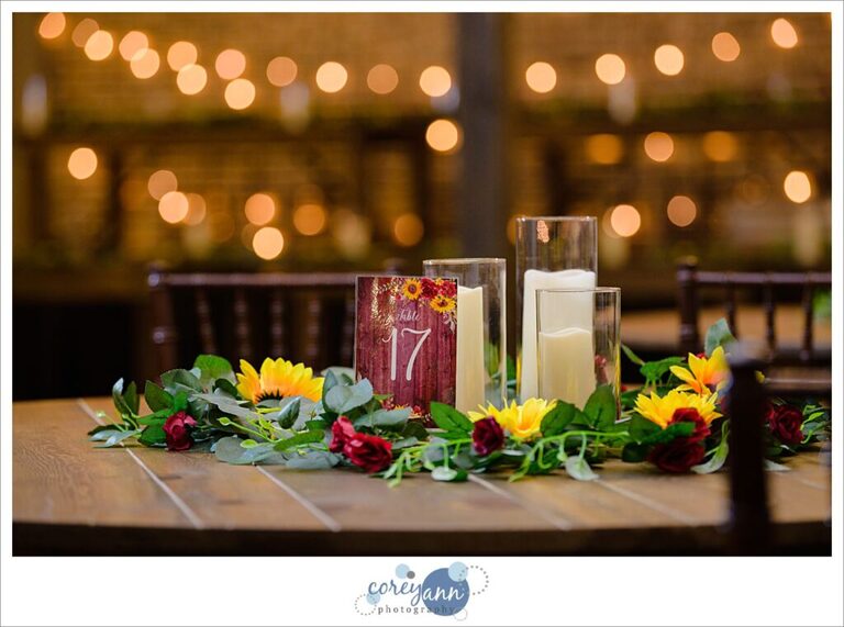 Sunflower and red rose flower reception decor at Gather at the Lakes