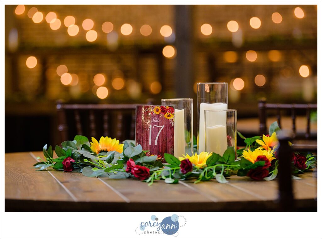 Sunflower and red rose flower reception decor at Gather at the Lakes
