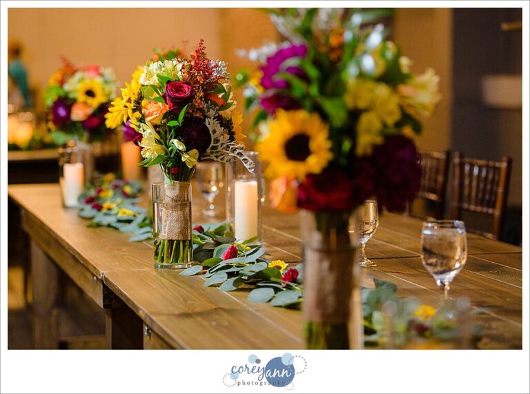 Sunflower and red rose flower reception decor at Gather at the Lakes