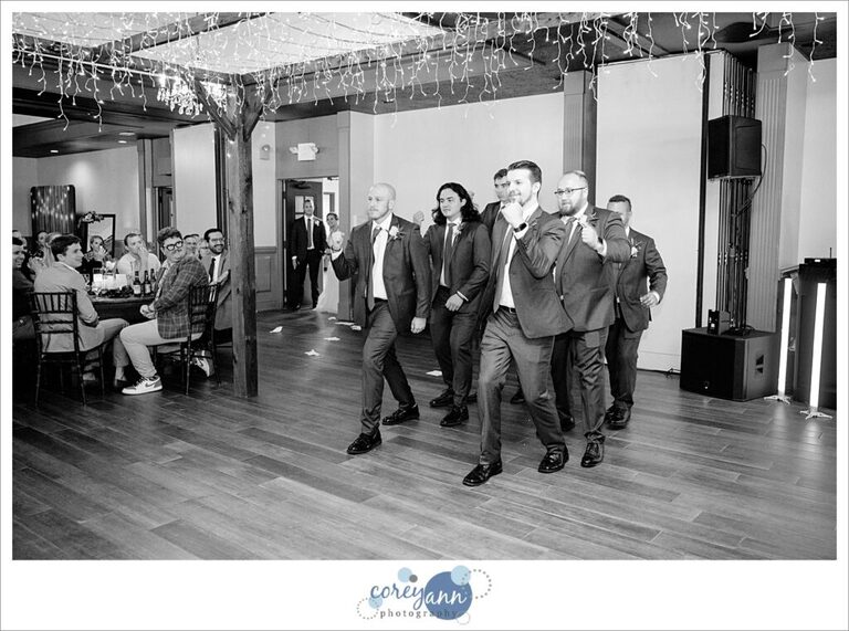 Groomsman doing a group introduction into wedding at Gather at the Lakes like The Office