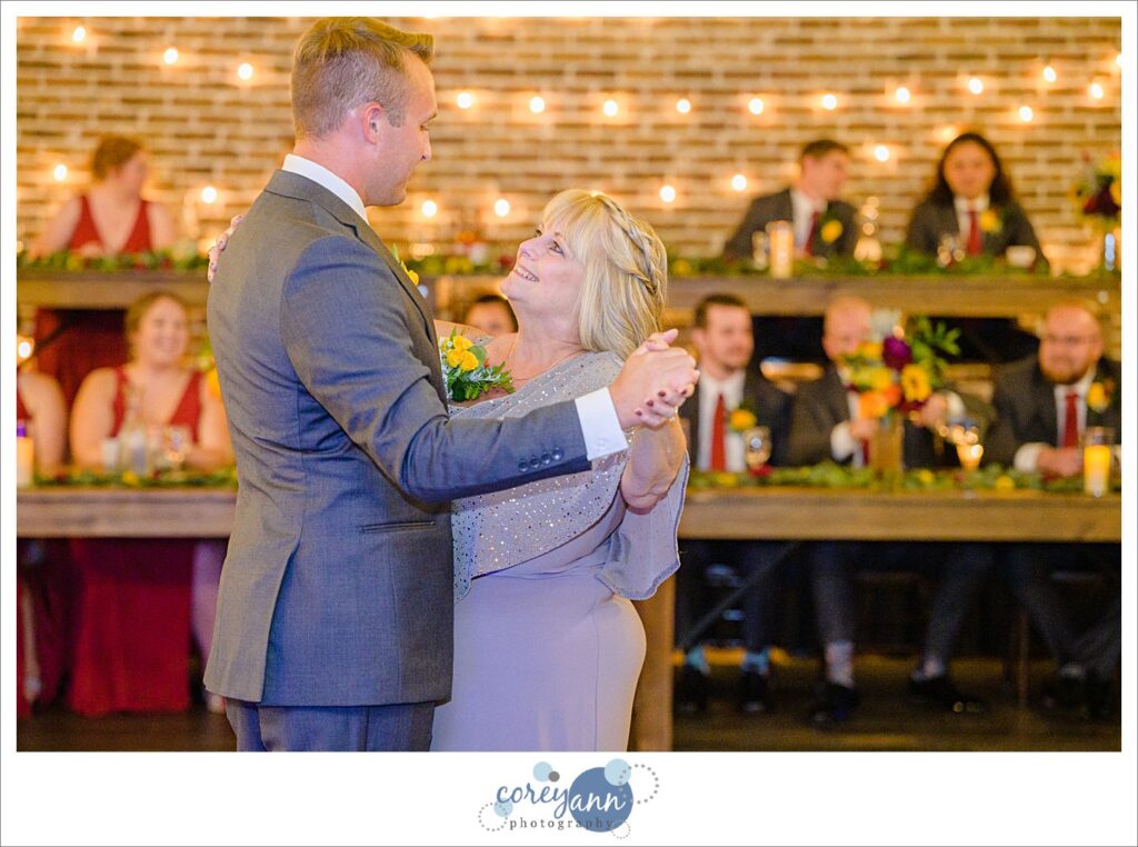 Mother and son dance at wedding reception at Gather at the Lakes