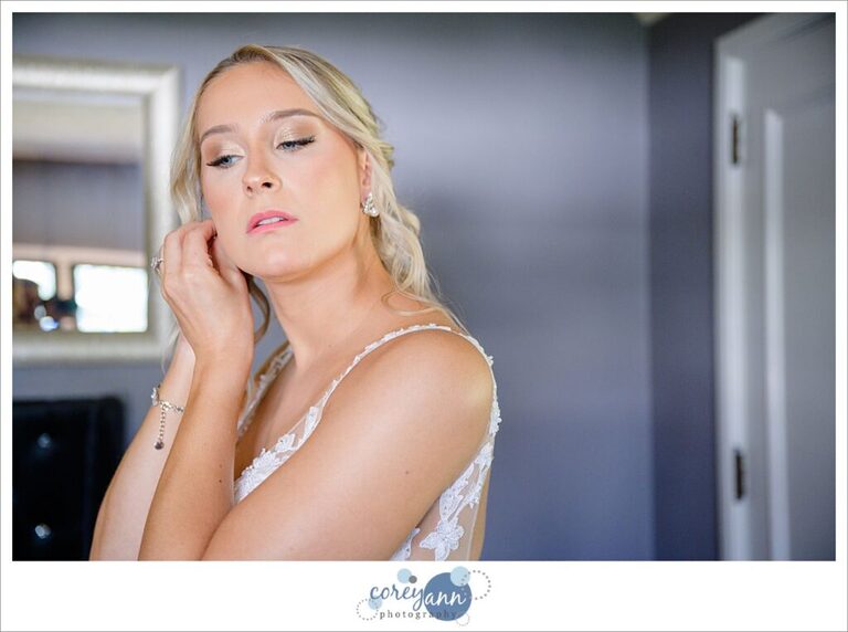 Bride getting ready for wedding at Tudor House on Portage Lakes in Akron Ohio