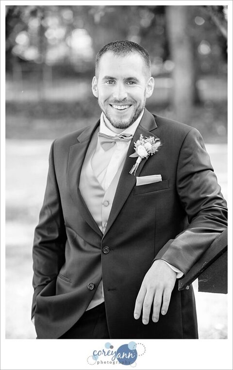 Casual portrait of groom before wedding ceremony in Akron Ohio at Tudor House on Portage Lakes