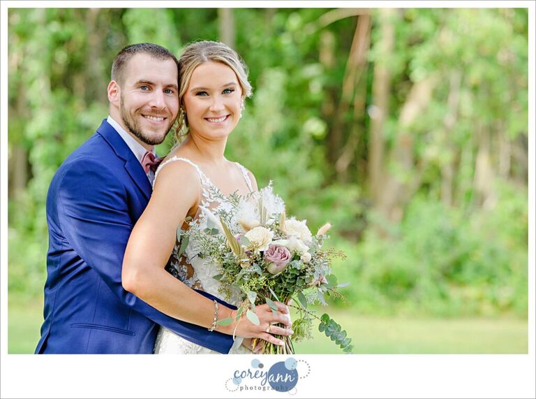 Casual portrait with bride and groom after wedding at the Tudor House on Portage Lakes in Akron Ohio