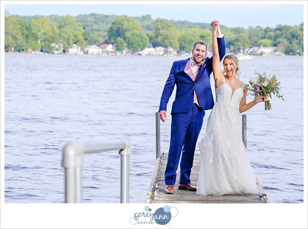 Bride and Groom posing on a dock on Portage Lakes in Akron Ohio