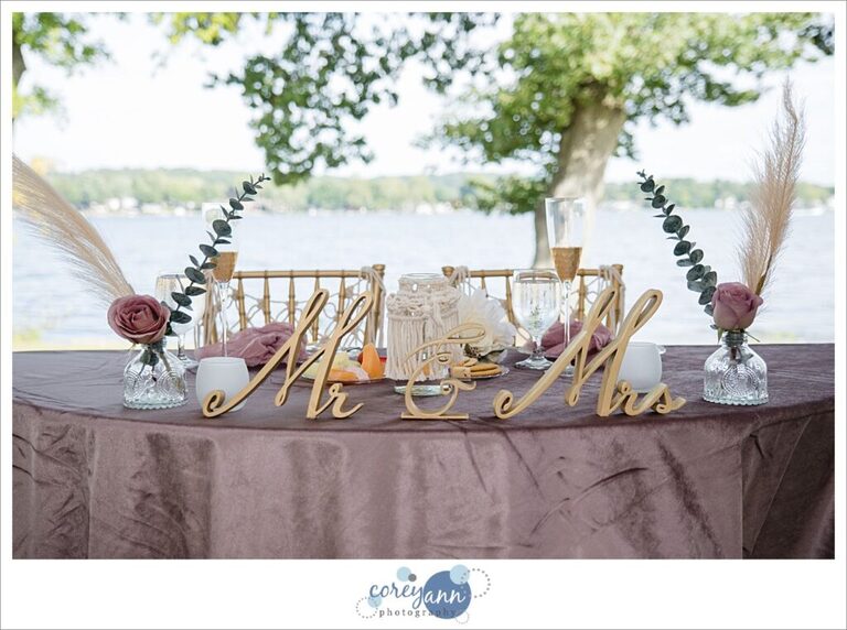 Pink and gold boho decor for a sweetheart table at a wedding at Tudor House on Portage Lakes