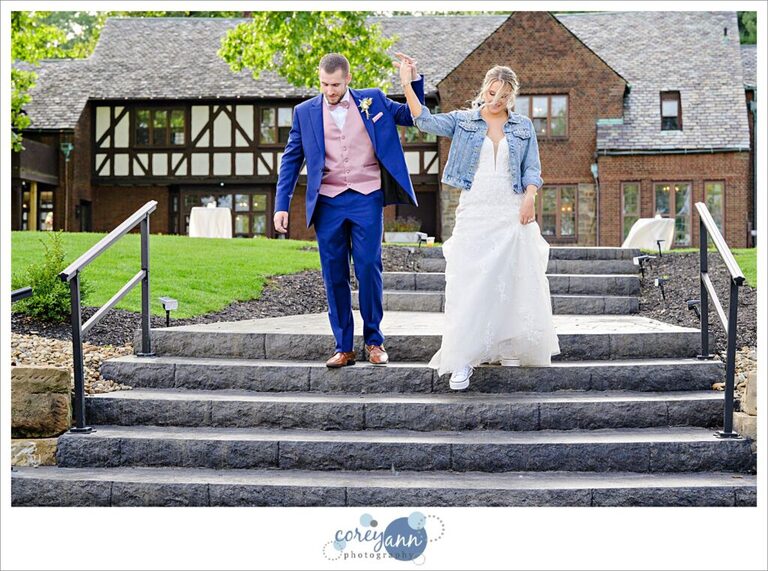 Bride and groom entering wedding reception tent at Tudor House on Portage Lakes