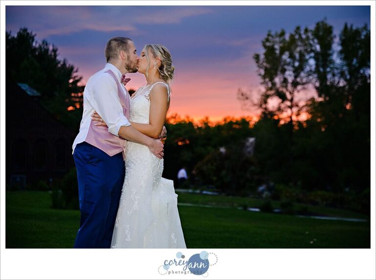 Bride and groom posing at sunset at Tudor House on Mason's Cove