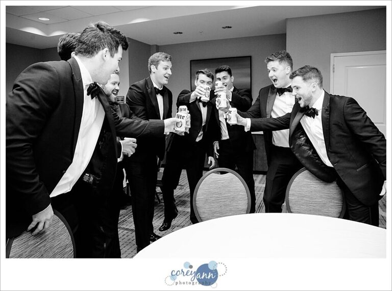 Groomsman and groom doing toast before wedding in Avon Ohio