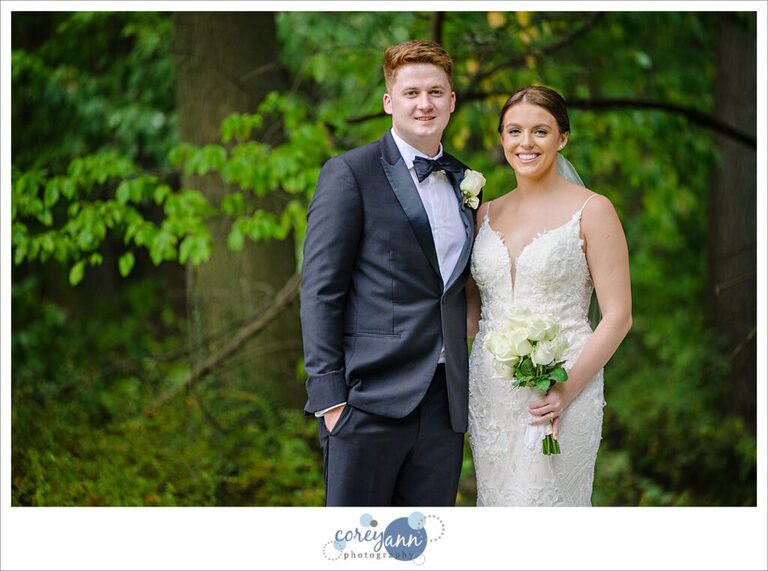 Bride and groom pose casually after wedding in Avon, Ohio