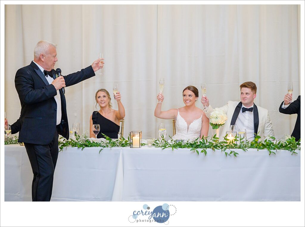 Toasts being given to bride and groom during their wedding reception at Emerald Event Center in Avon Ohio