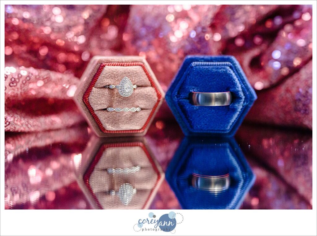 Wedding rings in blue and pink velvet boxes