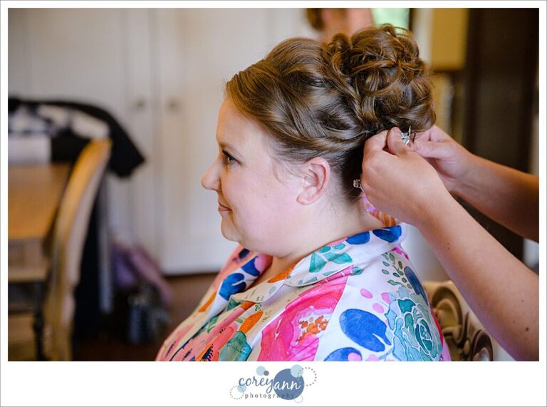 Bride getting her hair done in the bridal suite at Tudor House on Portage Lakes