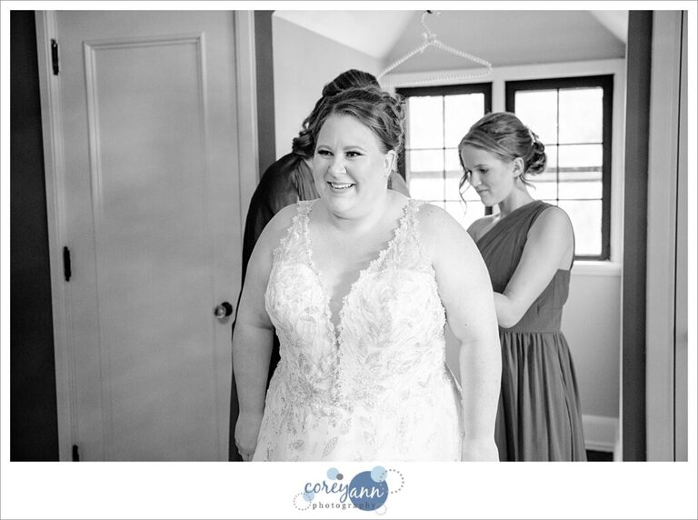 Bride getting dressed before wedding ceremony in Portage Lakes in Akron Ohio
