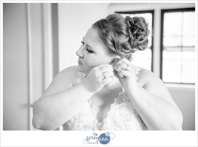 Bride getting dressed before wedding ceremony in Portage Lakes in Akron Ohio