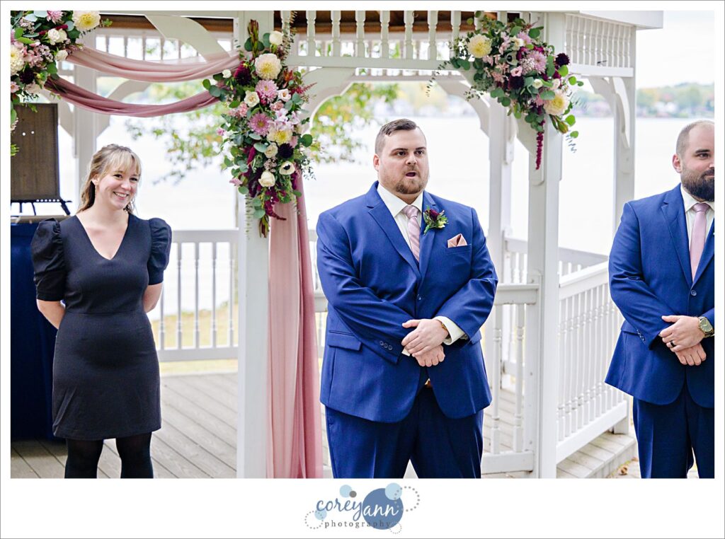Groom saying wow when seeing bride walking down the aisle in Akron Ohio