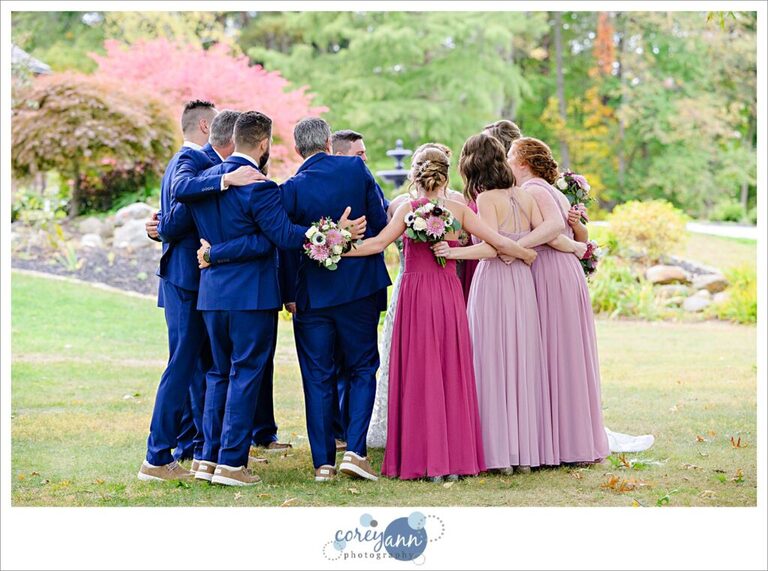 Bridal party group hug after wedding ceremony in Akron Ohio