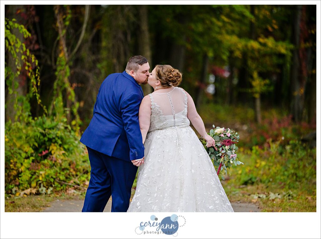Bride and Groom posing after their wedding at Tudor House on Portage Lakes in Akron Ohio