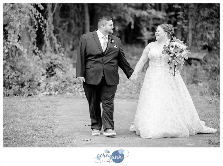 Bride and Groom posing after their wedding at Tudor House on Portage Lakes in Akron Ohio