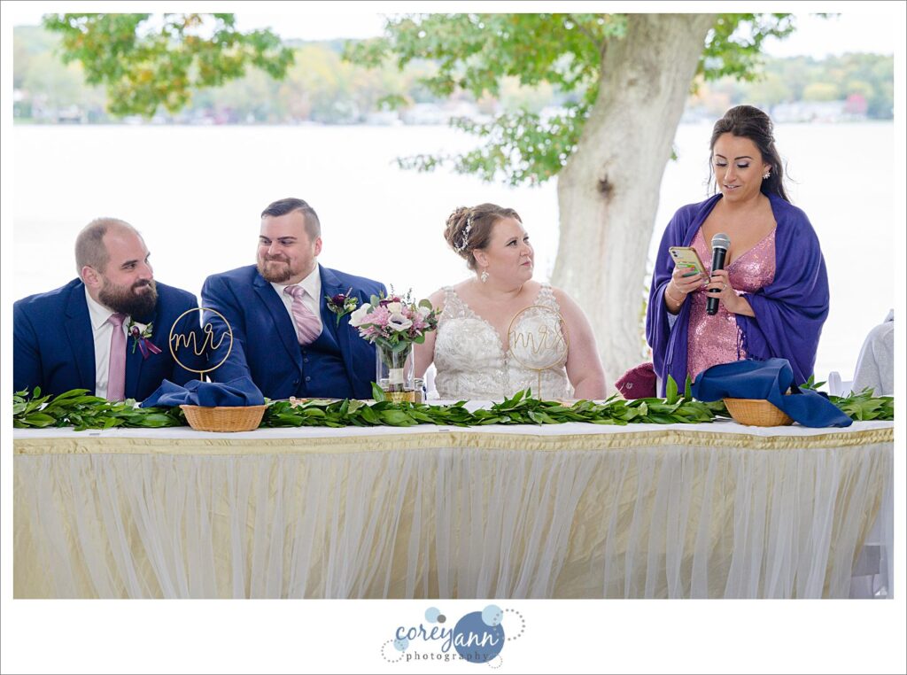 Wedding toasts being given during wedding reception at Tudor House on Portage Lakes in Akron Ohio