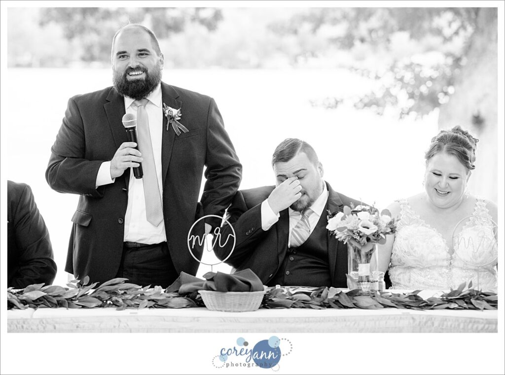 Wedding toasts being given during wedding reception at Tudor House on Portage Lakes in Akron Ohio