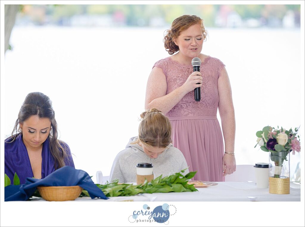 Wedding toasts being given during wedding reception at Tudor House on Portage Lakes in Akron Ohio