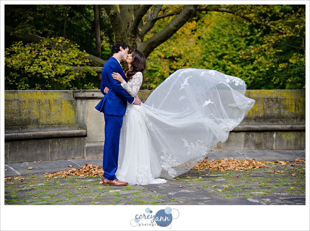 Bride's train being tossed in the air at the Cleveland Cultural Gardens in Ohio