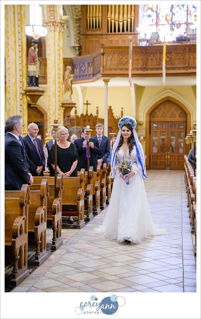 Bride walking down the aisle to start the wedding ceremony at St. Stanislaus Church in Cleveland Ohio