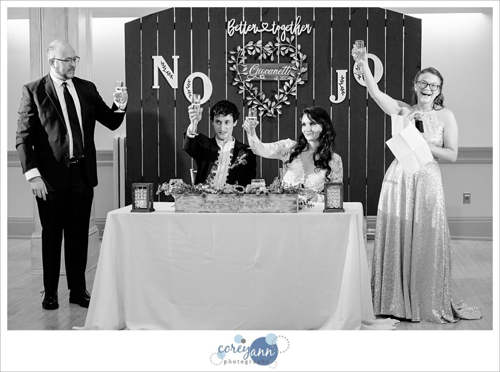 Wedding toasts during October wedding reception at Bohemian National Hall in Cleveland Ohio
