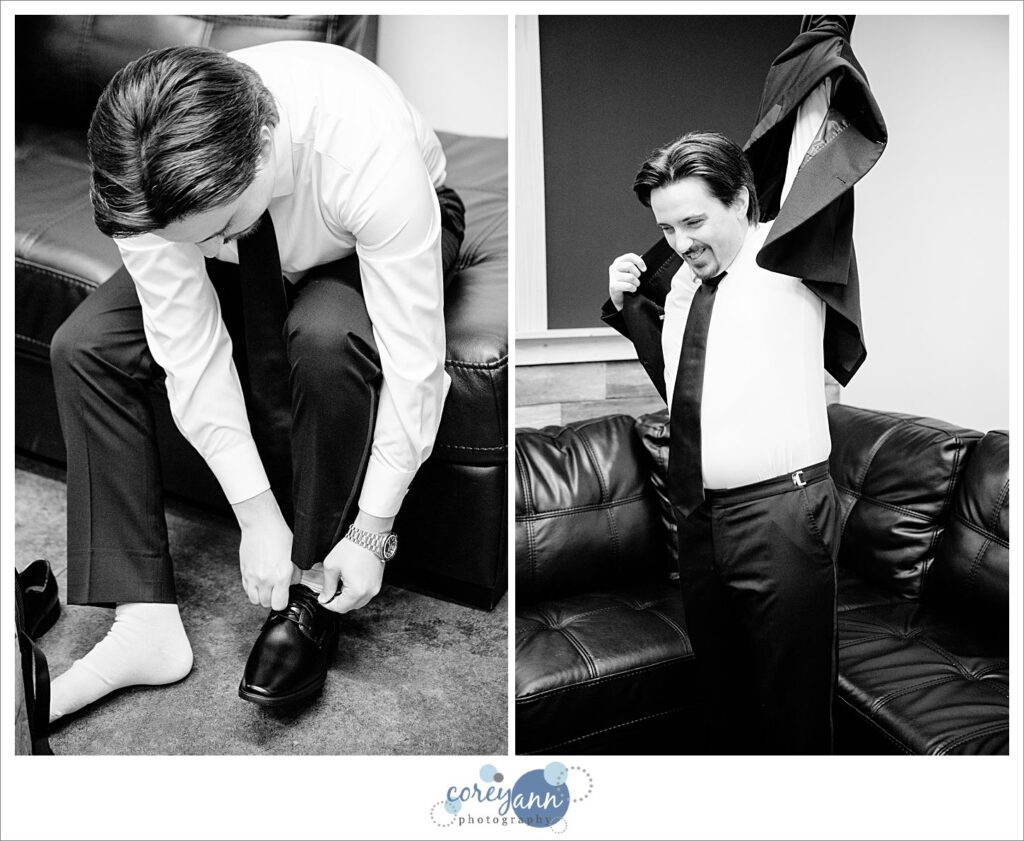 Groom getting dressed for wedding in the groom's suite at The Barn of Canal Fulton
