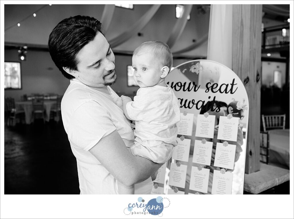 Groom holding his daughter before wedding in Ohio